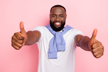 Photo of young good looking positive man show thumb up cheer you up good job isolated on pink color background