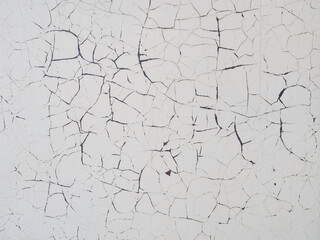 Texture of concrete wall with peeling white paint. Concrete wall with cracked paint texture. Full screen photo. Not seamless texture