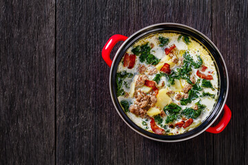 Zuppa Toscana,Tuscan Soup in red pot, top view