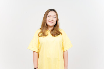 Smile and Looking away of Beautiful Asian Woman wearing yellow T-Shirt Isolated On White Background