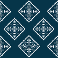 Ikat ethnic background vector. seamless square pattern of white traditional geometric shapes on dark blue background.