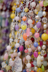 Shop window with necklaces and jewelry. Custome jewelry on display