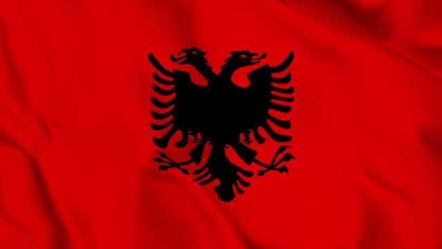 The flag of Albania is a red flag with a silhouetted black double-headed eagle in the center.. fluttering elegantly commemorating independence	