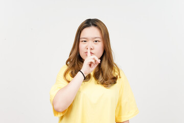 Shh Be Quiet of of Beautiful Asian Woman wearing yellow T-Shirt Isolated On White Background