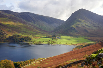 Views of Gatesgarth on the waters edge below the summits of Dale Head and Fleetwith Pike near Buttermere in the Autumn in the Lake District, UK.