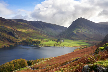 Views of Gatesgarth on the waters edge below the summits of Dale Head and Fleetwith Pike near Buttermere in the Autumn in the Lake District, UK.