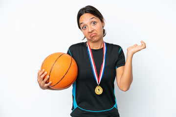 Young basketball player woman isolated on white background having doubts while raising hands