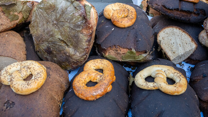 Traditional Latvian black baked bread on maple leaves