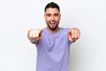 Fototapeta premium Young Arab handsome man isolated on white background surprised and pointing front