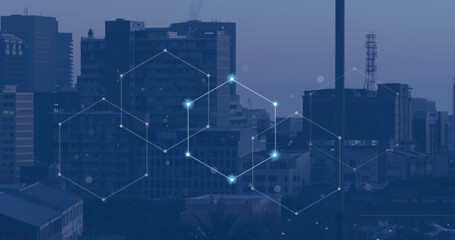 Image of network of connections with glowing spots over cityscape
