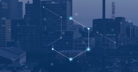 Image of network of connections with glowing spots over cityscape