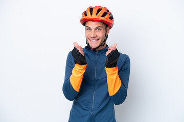 Young cyclist caucasian man isolated on white background making money gesture