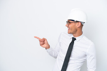 Young architect caucasian man with helmet and holding blueprints isolated on white background...
