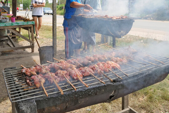 Large quantities of meat are roasted on roadside grills in Korat, Nakhon Ratchasima, Thailand