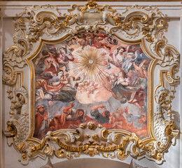 VALENCIA, SPAIN - FEBRUAR 17, 2022: The baroque fresco and stucco Glory of Eucharist in the church Iglesia de San MarÃ­n by JosÃ© Vergara Gimeno  (1726-1799).