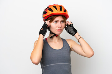 Young cyclist English woman isolated on white background having doubts and thinking