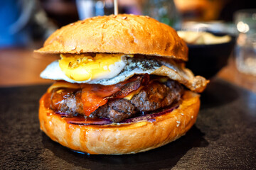 Close-up of delicious fresh hamburger on the table in restaurant.