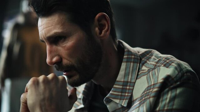 Dark Gloomy Portrait of Fragile Emotional man Crying being Bullied by Partner. Couple Arguing and Fighting Violently. Domestic Violence, Emotional Abuse. Rack Focus with Girfriend Screaming