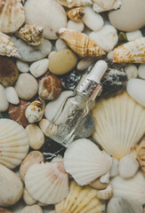 Bottle with cosmetics on the seabed. Selective focus.