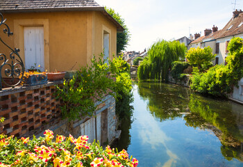 France. Scenic view of picturesque houses over canal in medieval town of Nemours. Seine-et-Marne department of Ile-de-France. Beautiful reflection. French countryside landscape. Rural tourism concept.