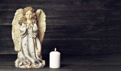 Condolence card with an angel and a burning candle