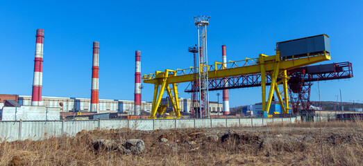 Factory chimneys and gantry crane