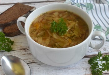 bowl of vegetable soup with bread