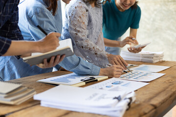 Colleagues working together in the office. Brainstorming, strategic analysis and marketing planning...