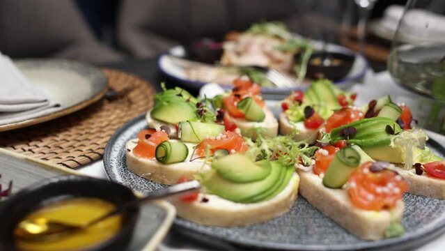 salads and snacks on the festive table in the restaurant at the wedding