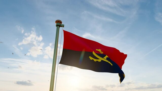 3840x2160. Flag of Angola waving in the wind, sky and sun background. Angola Flag video. 