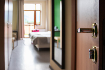 hotel booking online application, open door to the room, room interior