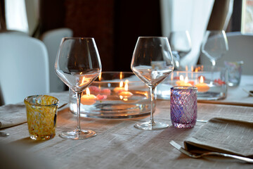 Table set with a centerpiece with water flowers and floating candles