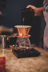 Coffee shop concept : Barista hand drip coffee on counter