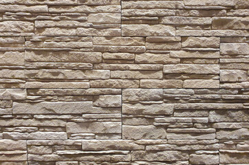 a close-up with a decorative stone wall