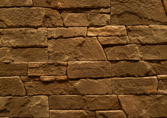 a close-up with a decorative stone wall