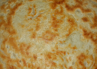 a close-up of a browned pancake