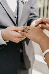 Obraz na płótnie Canvas wedding rings and groom