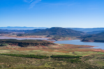 View of the Giribaile reservoir with abundant water in the flow. Photography made in Jaen, Andalusia, Spain.
