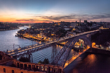 Fototapeta na wymiar Porto, Portugal cityscape over the Douro River and Dom Louis Bridge.