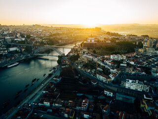 Fototapeta premium Porto Portugal Aerial View. Dom Luis Bridge at Sunrise. Porto, Portugal. Cityscape of Downtown Touristic Ribeira. Olt Town. Douro River.