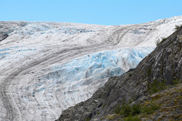 Fototapeta na wymiar Exit Glacier is part of the Harding Icefield in Alaska’s Kenai Mountains of and one of Kenai Fjords National Park's major attractions. It is one of the most accessible valley glaciers in Alaska and is