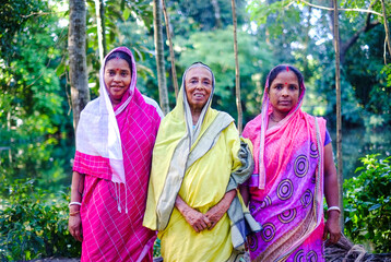 Fototapeta na wymiar South asian family picture, mother with her daughters, Bangladeshi hindu religious women in traditional dress 