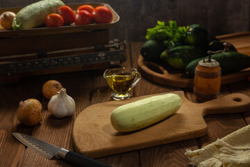 Ingredients for cooking zucchini snacks on a wooden table. Cooking.