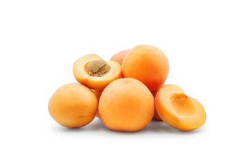 Heap of fresh ripe apricots whole and halves isolated on white background