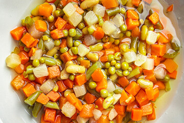 mix vegetables cut cubes beans, peas, green beans, carrots, celery Macedonian vegetables bunch of juicy vegetables fresh dish healthy meal food snack diet on the table copy space food background 