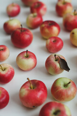 hello autumn card with fresh red apples on white background top view