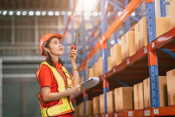Warehouse woman foreman staff worker work in cargo inventory products box store house with radio control