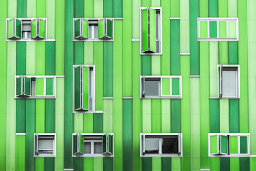 Modern green building with opened windows