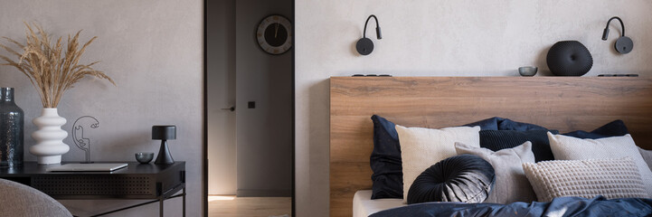 Comfortable bedroom with desk and mirror, panorama