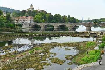 Fototapeta premium Po river dramatically dried up due to climate change caused by human pollution in the environment Turin Italy July 29 2022